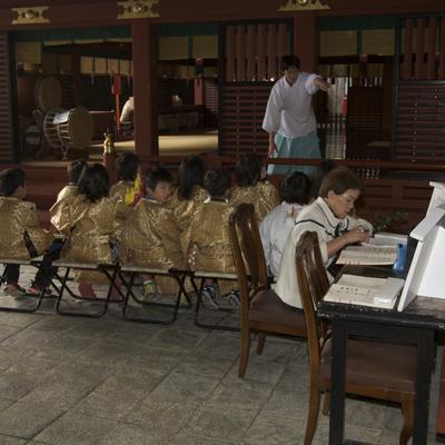 A group of children who are preparing to perform a ritual.