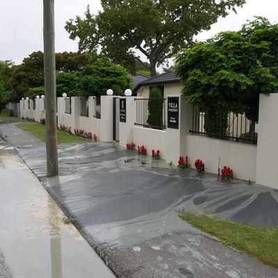 Large amounts of silt covering the sidewalk.