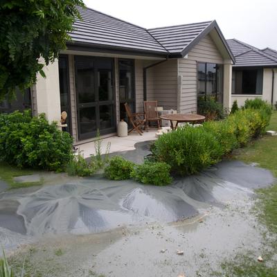 Retirement homes' gardens damaged by silt and water.