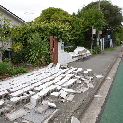 Many cinder block fences had fallen over.